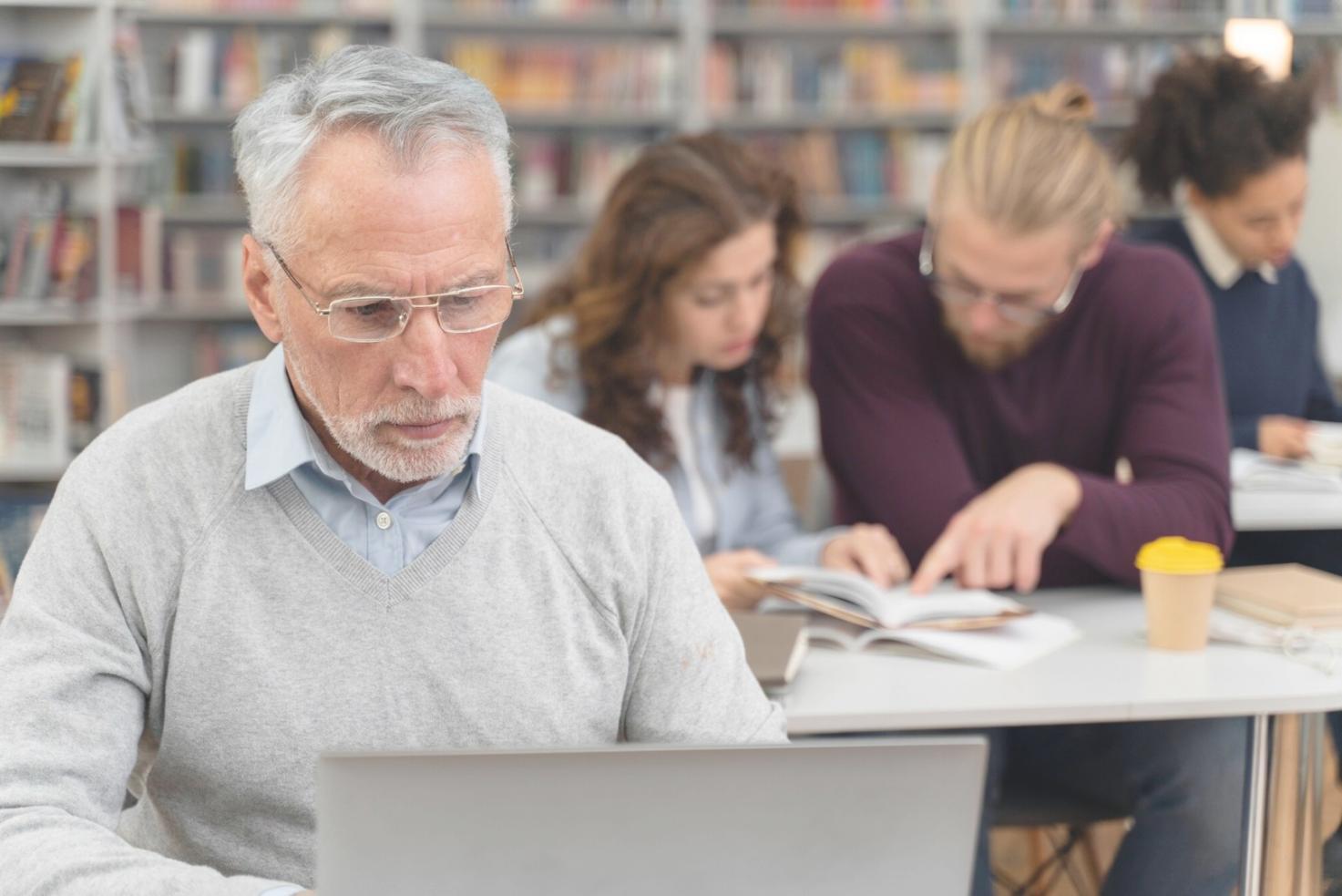 Professional financial training session with participants reviewing investor reporting strategies